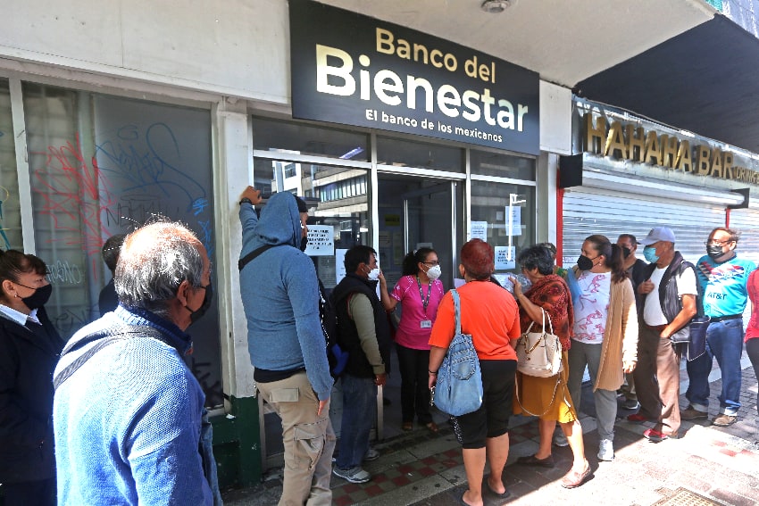 Seniors wait in line for their pensions