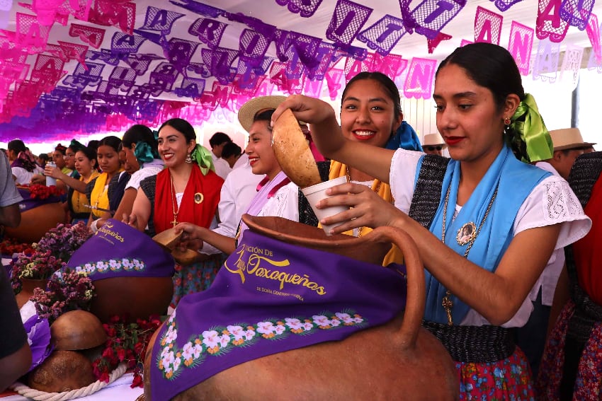 Woman pouring drinks into cups