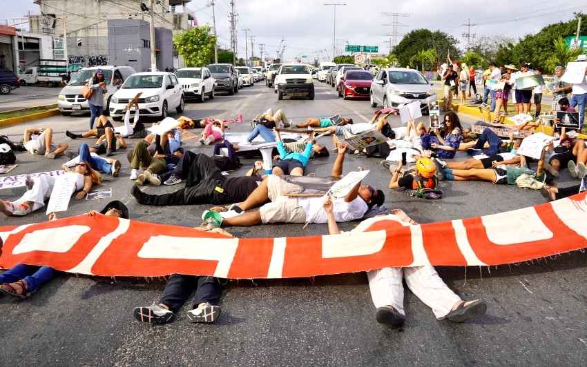 Protesters block a road in Playa del Carmen