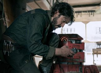 Actor Diego Luna, who will receive an award at the Guadalajara Film Festival, hunched over a machine part in a tool workshop in the Star Wars film "Andor"