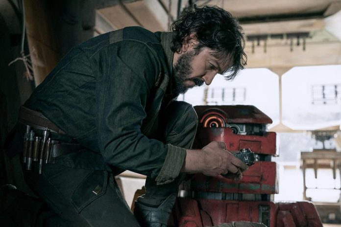 Actor Diego Luna, who will receive an award at the Guadalajara Film Festival, hunched over a machine part in a tool workshop in the Star Wars film 