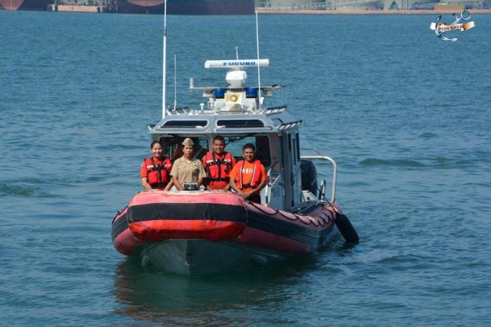 Members of Mexico's Navy travel on a rescue boat