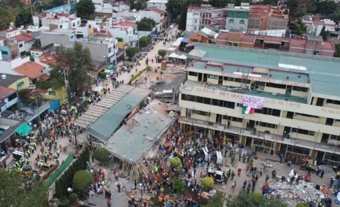 Rescue workers look for survivors at the Rébsamen school in Mexico City.