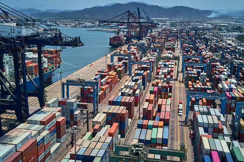 Shipping containers sitting in a port deck